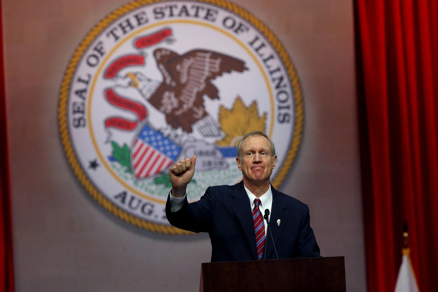 Gov. Bruce Rauner gives a thumbs up after giving his first speech as governor on Monday Jan. 12, 2015 at the Prairie Capital Convention Center in Springfield, Ill. Local democrats blasted Rauners speech regarding Illinois budget impasse this week.