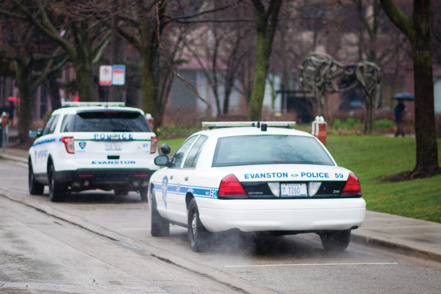 Two parked Evanston police cars. The Evanston Police Department in partnership with University Police received a grant to implement body cameras.