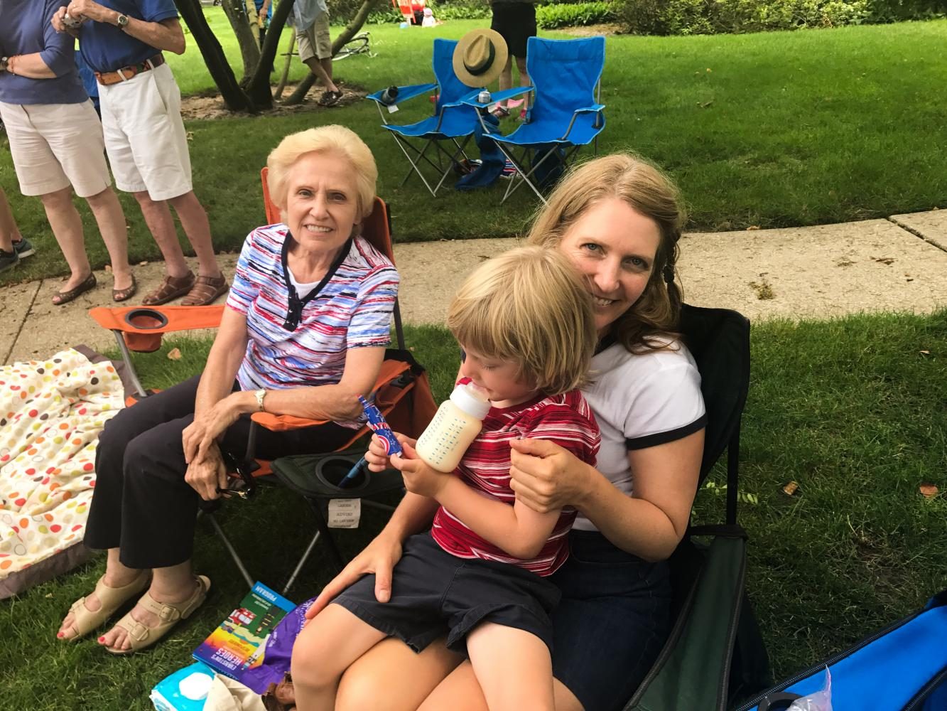 Karen Gliwa enjoys the parade with her 3-year-old son and her mother. “Fourth of July to me is about family and independence,” she said.