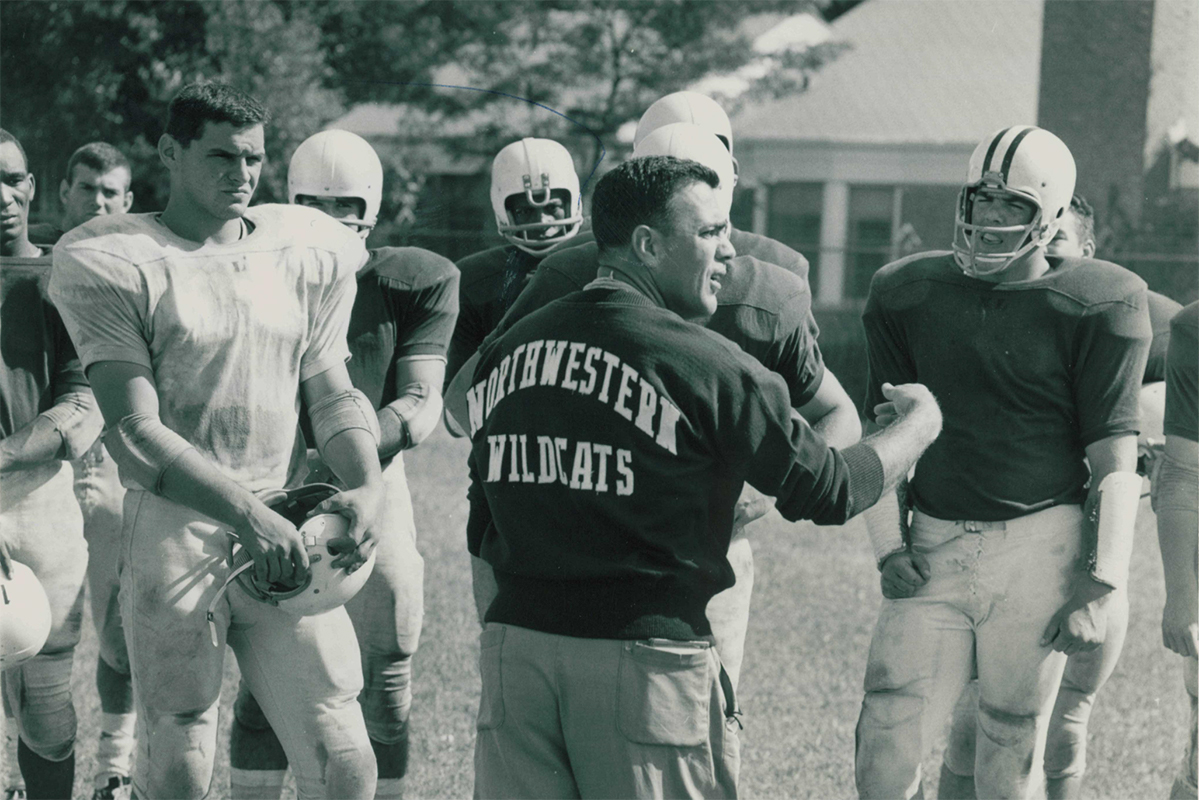 Ara Parseghian instructs a group of Northwestern football players. Parseghian coached NU from 1956 to 1963.