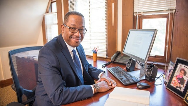 Dwight Hamilton sits at his desk. Hamilton took over as Northwesterns new associate vice president of equity on July 1.