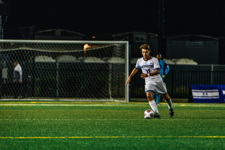 Mattias+Tomasino+dribbles+the+ball.+The+sophomore+midfielders+assisted+on+Mac+Mazzolas+game-tying+goal+Friday.