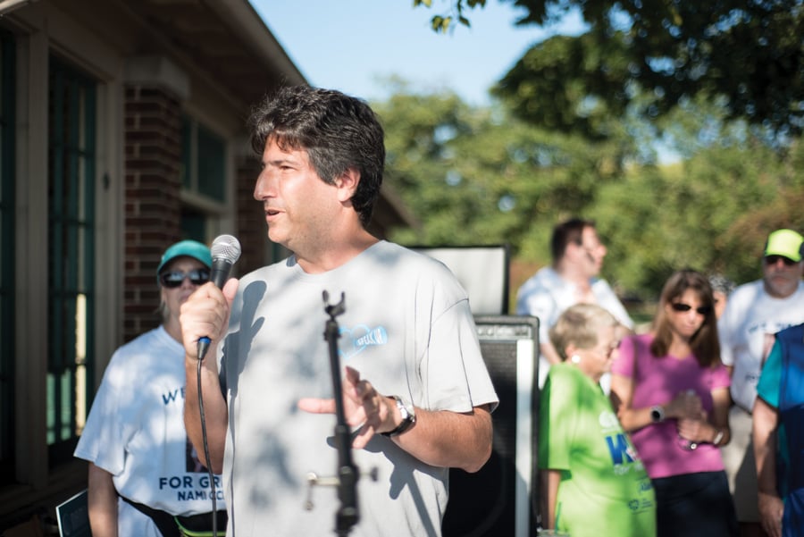 Steven Arkin, father of Jason Arkin who took his own life in 2015, gives a speech at the NAMI Cook County North Suburban 5k RUN WALK. The walk, which was located on campus, was held to raise awareness against mental illness stigma.