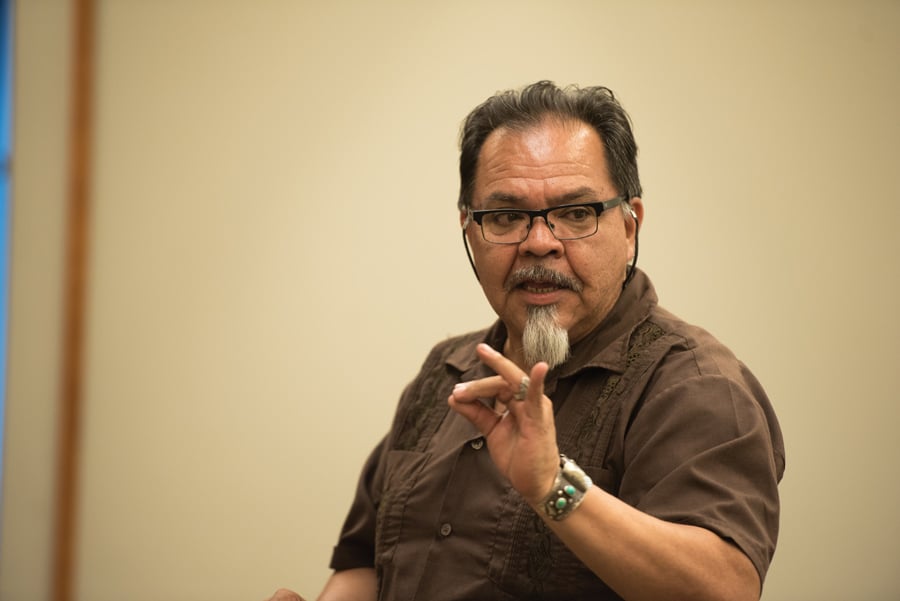 DePaul Prof. Juan Mora-Torres speaks to an audience at Evanston Public Library. At a documentary screening and discussion on Saturday, Mora-Torres argued that U.S. arms sales to Mexico reinforce endemic corruption within the Mexican government and exacerbate the drug war. 