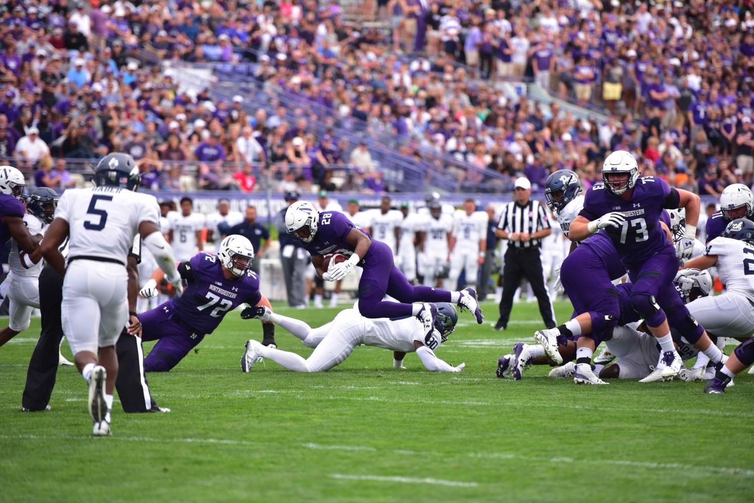 Jeremy Larkin dives forward. The redshirt freshman and the Wildcats pulled out a win against Nevada on Saturday.