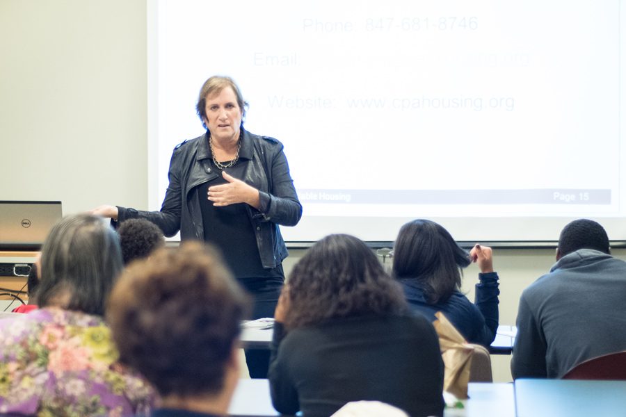 Amy Kaufman, Associate Director of Community Partners for Affordable Housing, speaks to an audience at Evanston Public Library. CPAH, an organization that builds and refurbishes affordable housing units taught Evanston residents how to apply for one of their homes. 