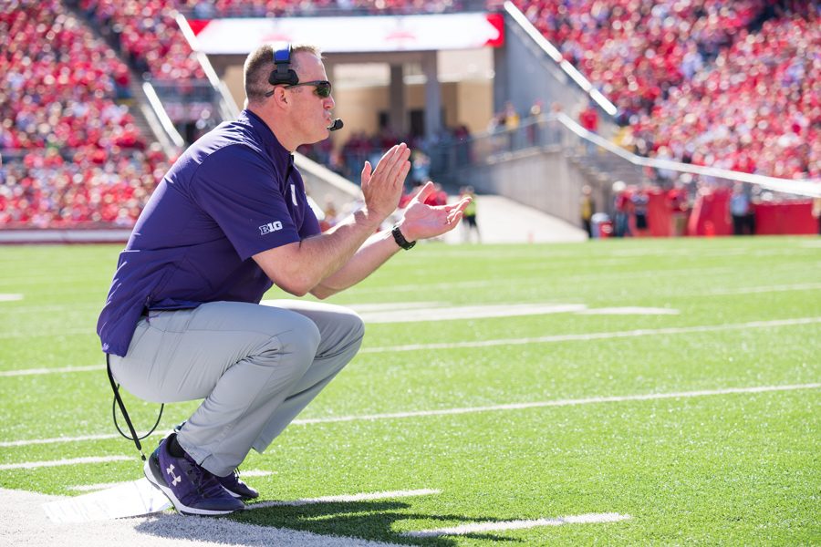 Pat Fitzgerald coaches from the sideline. Fitzgerald this week defended a controversial option play-call on fourth-and-three against Penn State. 