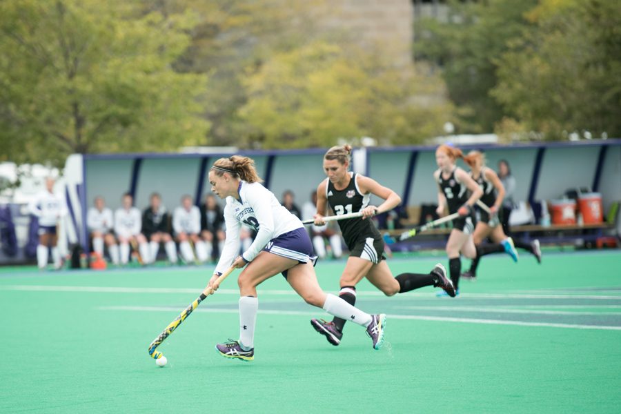 Puck Pentenga dribbles the ball. The junior midfielder was named Big Ten Offensive Player of the Week after scoring three goals and assisting on another last weekend.
