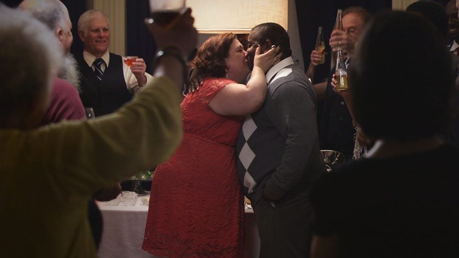 Grace (Sara Sevigny) and Zeke (Antoine McKay) kiss at a party. The two played one of the interracial couples in “Rogers Park.”
