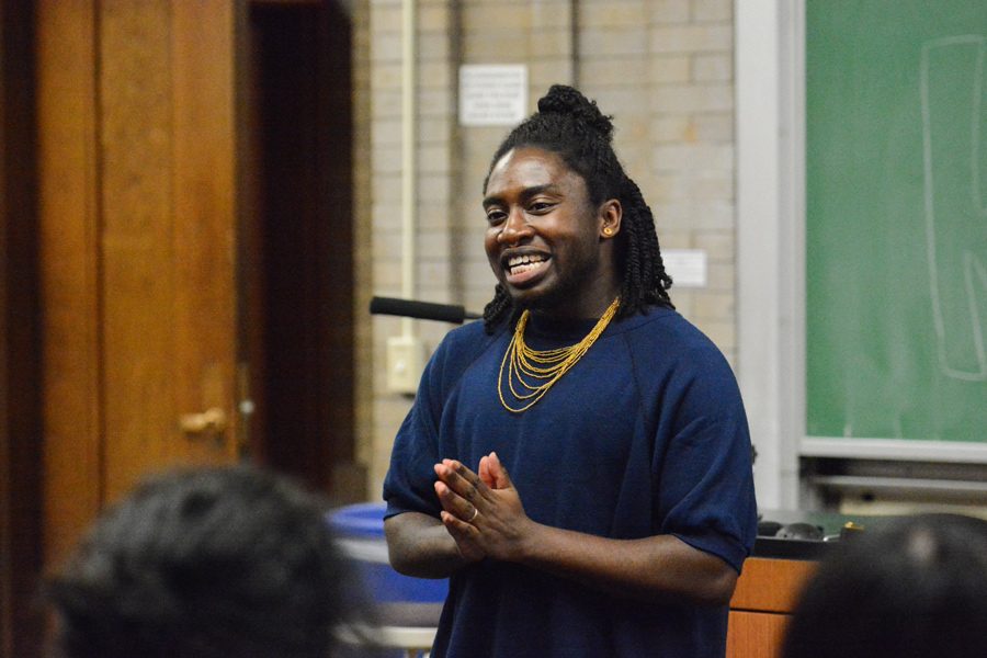 Kavi Ade performs at a Rainbow Week event on Thursday. The spoken word poet read some of their work and discussed their experiences with race, gender and politics.
