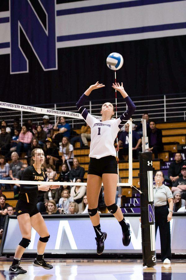 Taylor Tashima sets the ball. The senior setter and the Wildcats won their first Big Ten match of the season Friday at Rutgers.