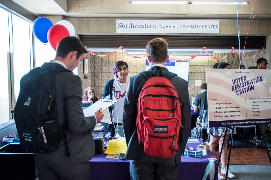 NU Votes volunteers speak to students at a voter registration booth in September 2016. Northwestern won five awards for civic engagement at a ceremony Thursday, including the highest increase in voter registration among all U.S. universities.  