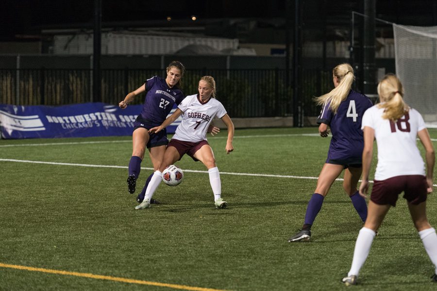 Kayla Sharples fights for the ball. The junior defender and the Wildcats will put their two-game win streak on the line against Nebraska on Saturday.
