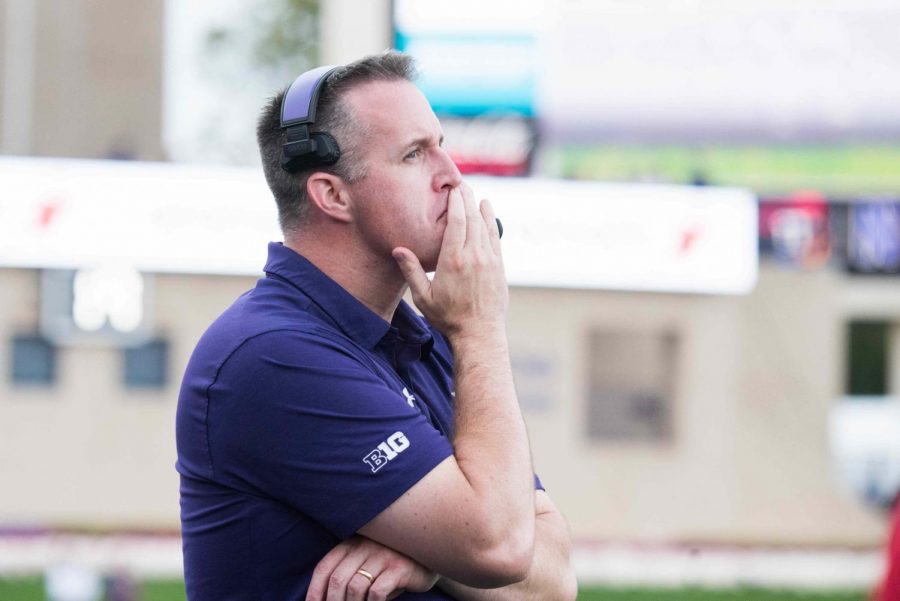 Pat Fitzgerald looks on from the sideline. The coach said windy conditions at Ryan Field played into his decision-making Saturday.