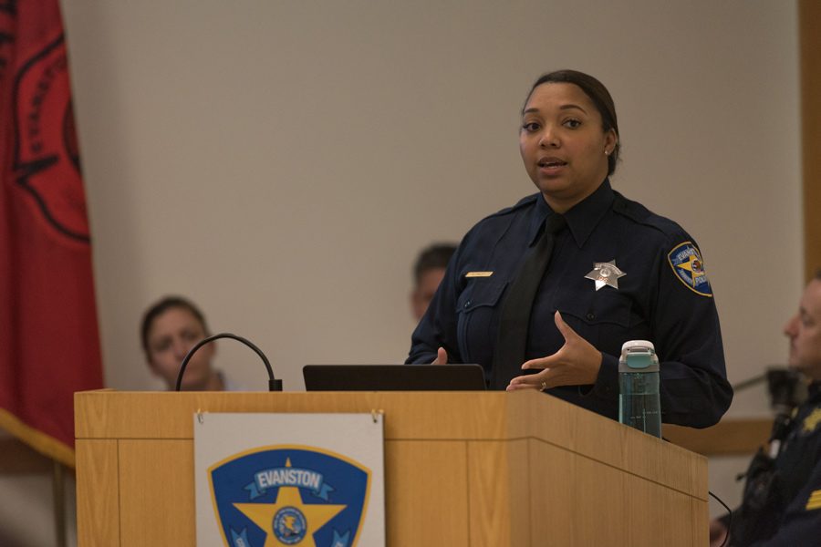 Officer Enjoli Daley talks during the information session for the new Police Explorer Program. After 30 years of inactivity in Evanston, the program will prepare youth for careers in law enforcement. 
