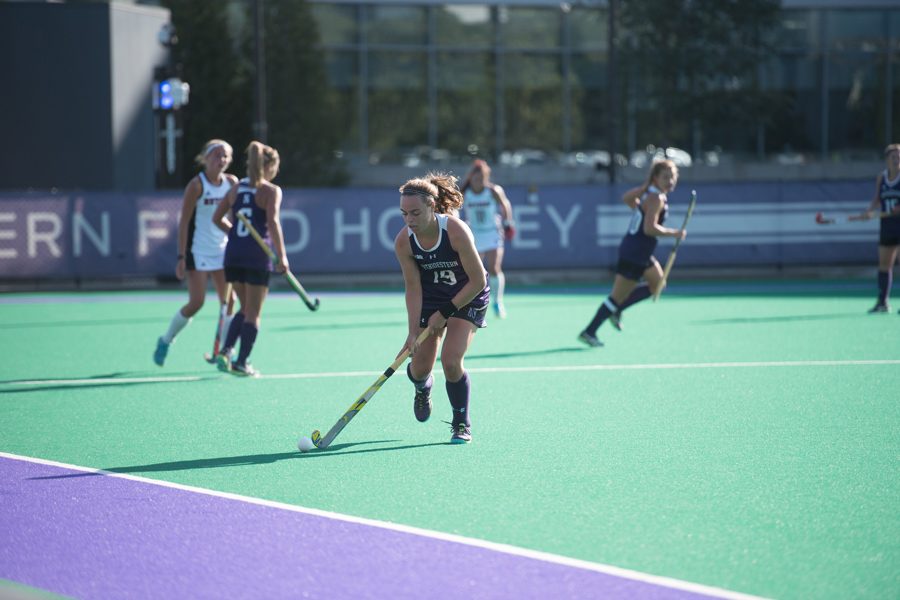 Puck Pentenga runs upfield. The junior midfielder and the Wildcats will face Louisville in the first round of the NCAA Tournament on Saturday. 