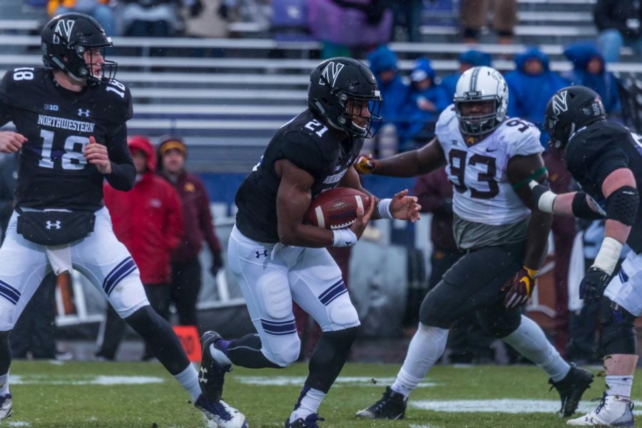 Justin Jackson runs with the ball. The senior running back carved up 166 yards against Minnesota on Saturday.
