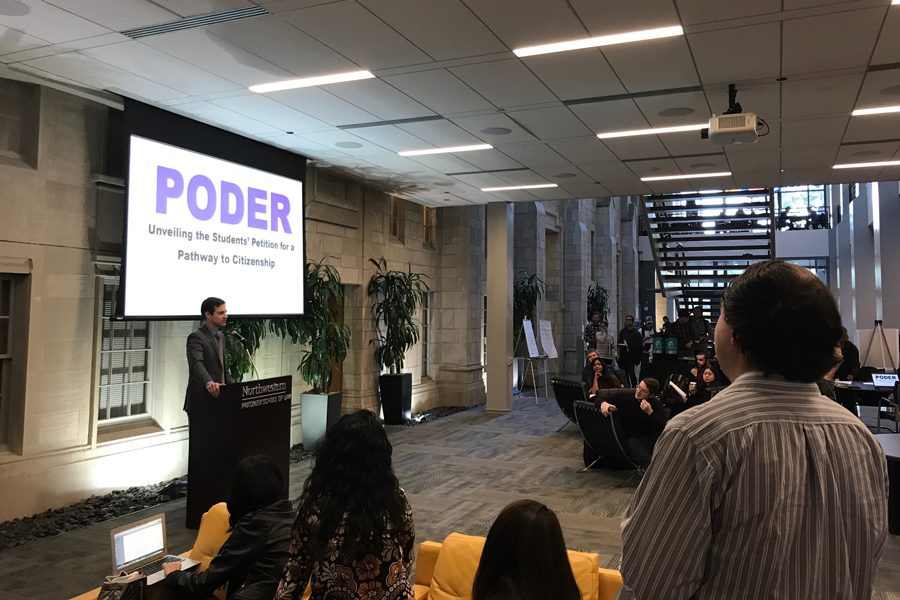 First-year+law+student+and+co-founder+of+PODER+Charlie+Isaacs%2C+speaks+in+the+Rubloff+Atrium+on+Wednesday.+The+petition+called+for+Congress+to+create+legislation+to+support+DACA+recipients.