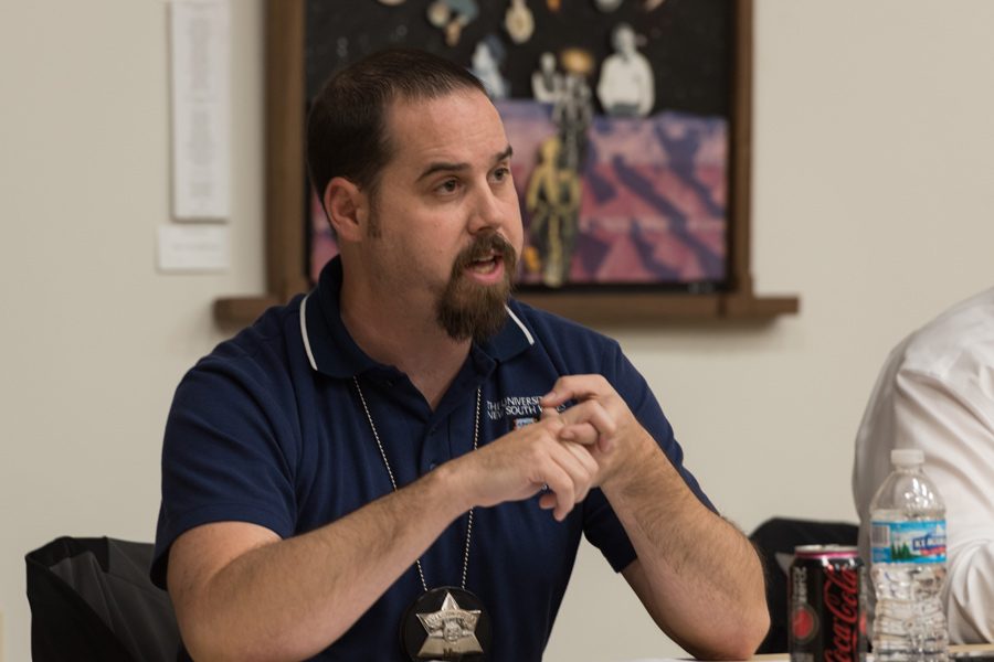 Detective Christopher Tortorello speaks at an Evanston Police Department town hall at the Lorraine H. Morton Civic Center on Thursday. Tortorello and two other officers talked about drugs, gangs and unsolved homicides.