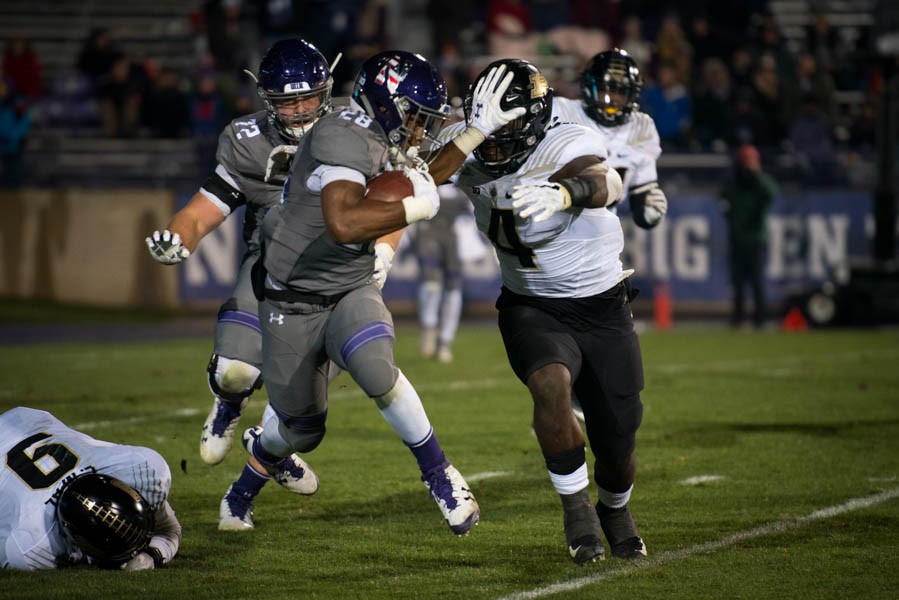 Jeremy Larkin stiff-arms a defender. The redshirt freshman running back and Northwestern topped Purdue on Saturday night.
