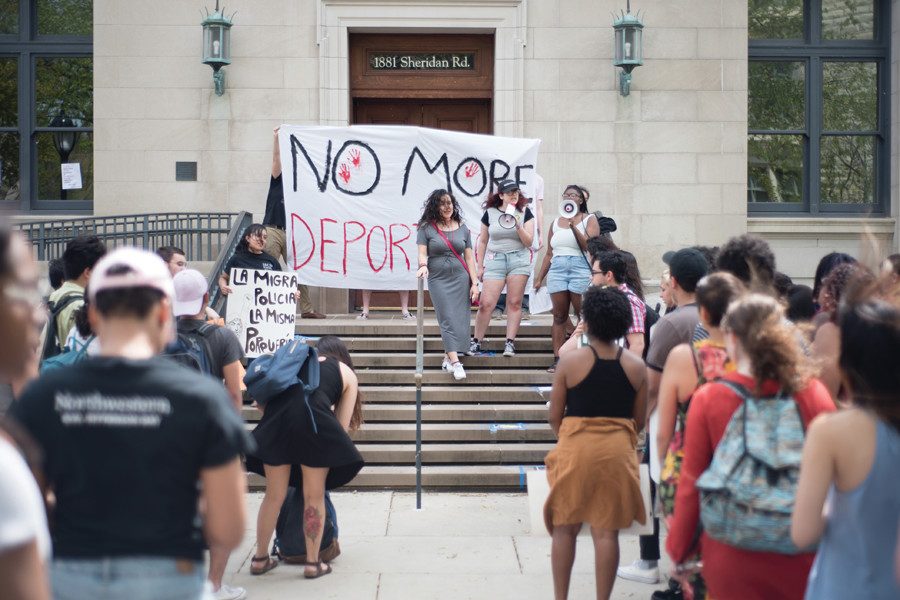 Students gathered outside Harris Hall to protest the visit of an Immigration and Customs Enforcement representative in May. A student coalition plans to meet with administrators this quarter to revise Northwestern’s protest policy. 