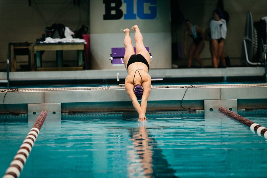 A+Northwestern+swimmer+dives+into+the+pool.+The+Wildcats+will+look+to+pick+up+their+first+conference+victory+of+the+season+this+weekend.