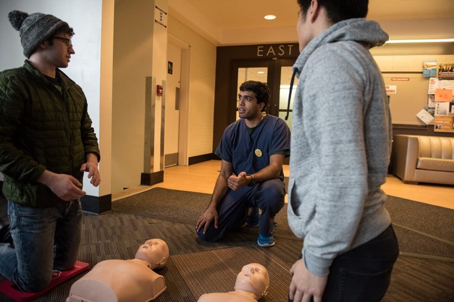 Texas medical student Shyam Murali teaches Texas Two Step CPR to passersby in Foster-Walker Complex. The training event was part of a national effort to increase knowledge of bystander intervention technique.