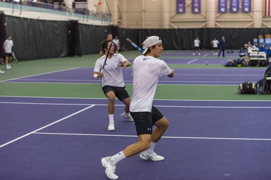 Chris Ephron (right) and Antonioni Fasano (left) attack the net. The duo teamed up for the first time last weekend against Oklahoma State.