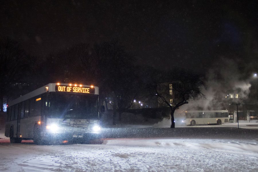 A+bus+traverses+the+snow.+City+officials+are+preparing+for+a+snowstorm+that+will+hit+Evanston+this+weekend.+