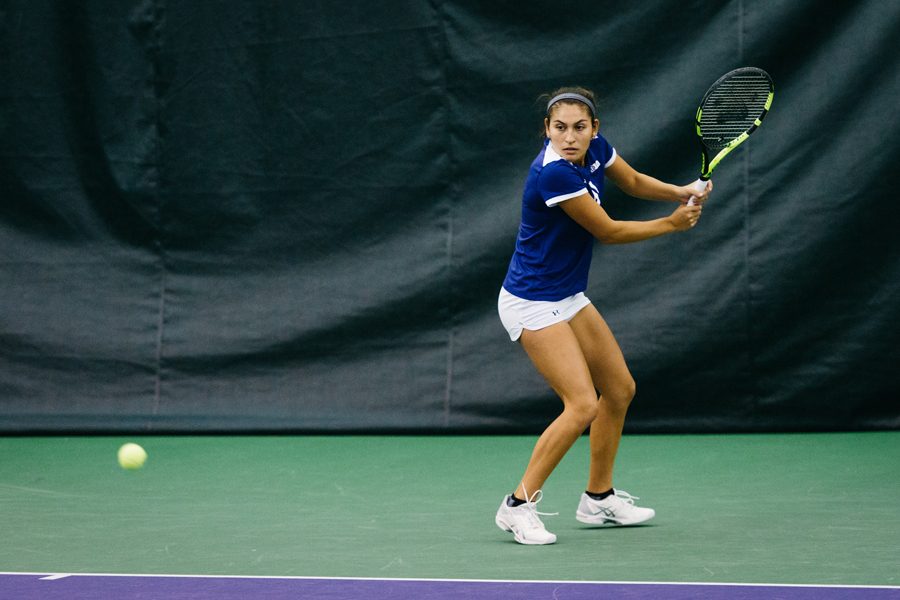 Caroline Pozo prepares to hit a backhand. The freshman and the Wildcats will be up against a tough challenge with No. 7 Vanderbilt this weekend.