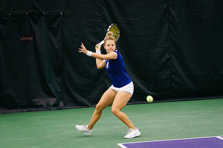 Caroline Pozo prepares to strike a backhand. The freshman and the Wildcats take on No. 11 Texas on Sunday in a battle of ranked teams.