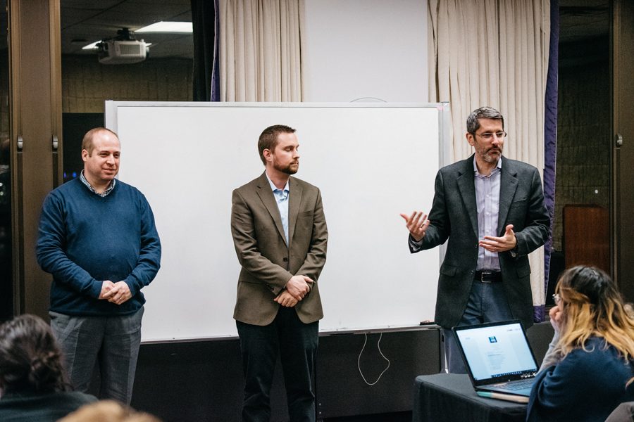 Brad Zakarin, Tim DeBold and Paul Hubinsky — members of the Undergraduate Residential Experience Committee — discuss the housing report with Associated Student Government senators Wednesday. Senators also elected two new vice presidents during their meeting. 