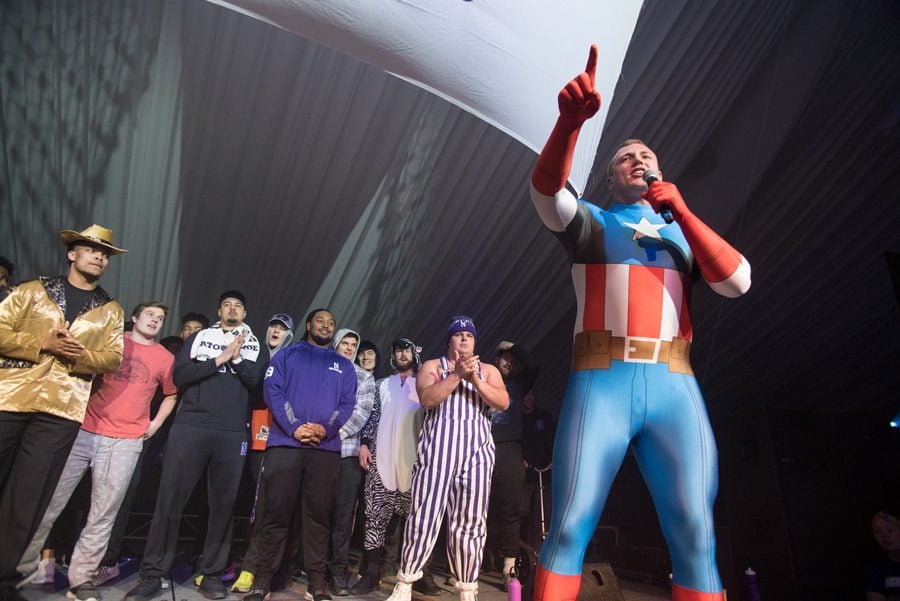 Weinberg junior and right guard Tommy Doles sports a Captain America bodysuit. The football team went on stage during Block 7 after a video from former Northwestern superback Dan Vitale.
