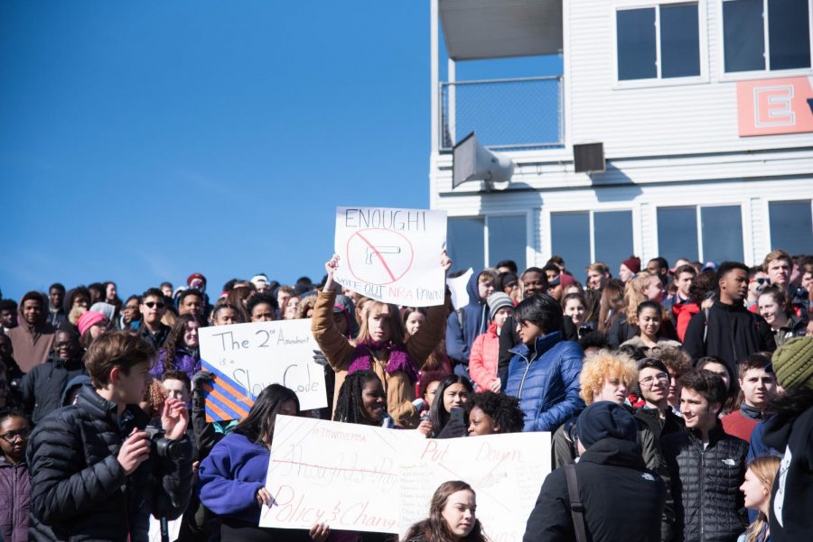Students gather at the ETHS football field on Wednesday for the walkout to protest gun violence. 