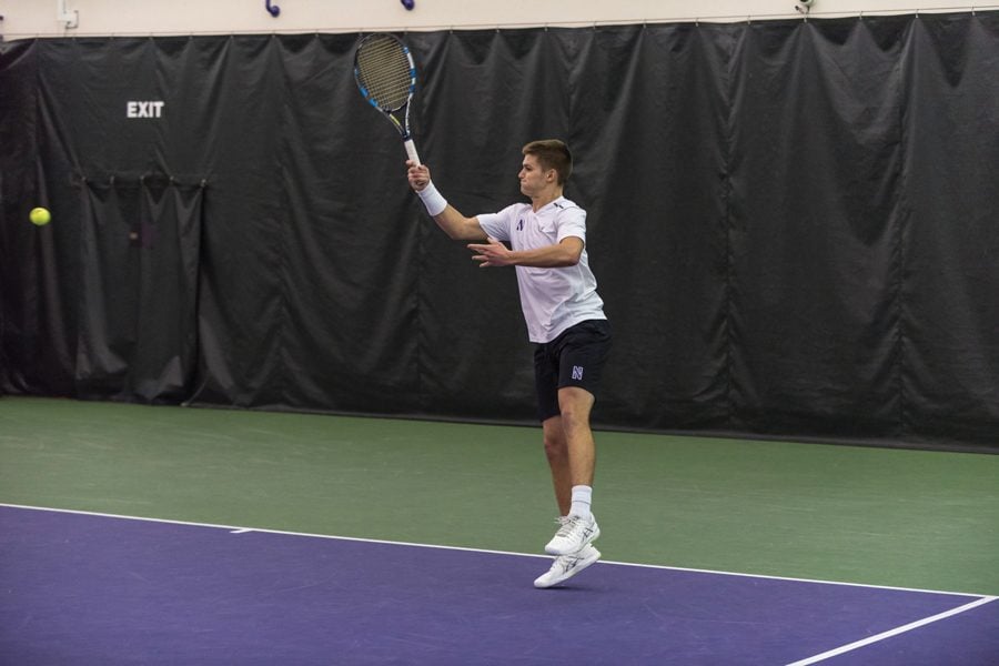 Michael Lorenzini follows through on a forehand. The junior and the Wildcats open conference play this weekend.