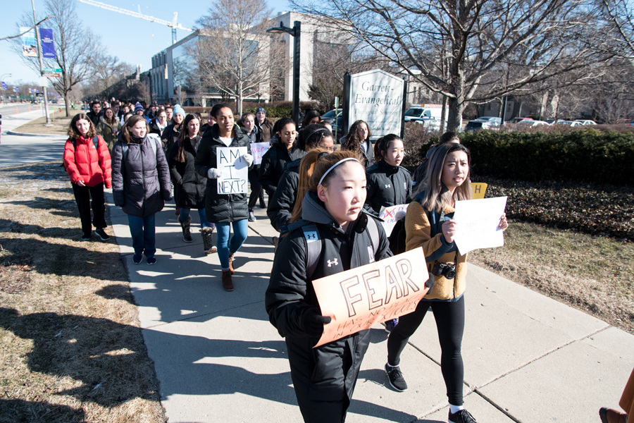 Northwestern+students+walk+out+on+Sheridan+Road+on+Wednesday%2C+March+14.+