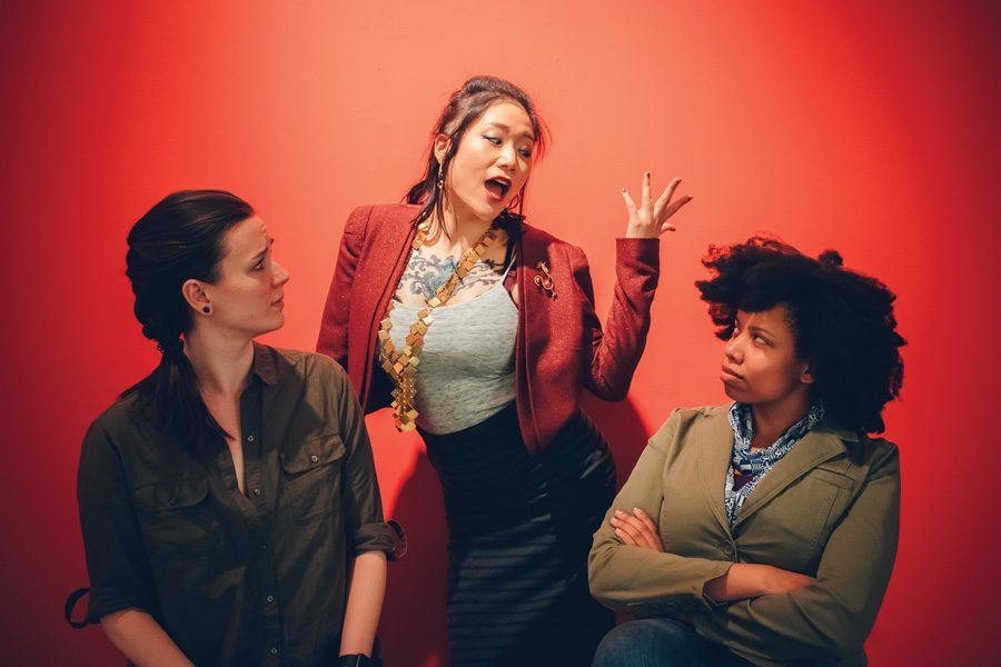 Kyle Lovett (left), Wanda Jin and Kenya Ann Hall play the roles of audience members and lecturer in a self-help seminar. “Cornerstone” explores the phenomenon of self-help culture.
