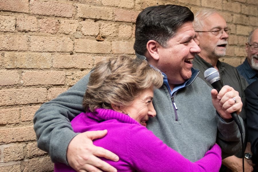 Democratic gubernatorial candidate J.B. Pritzker pulls U.S. Rep. Jan Schakowsky (D-Ill.) into a hug at a meet and greet Saturday. Pritzker and Schakowsky spoke about the importance of voting in November and defeating incumbent Gov. Bruce Rauner.