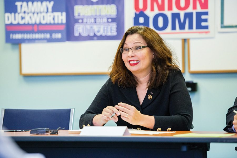 Sen. Tammy Duckworth (D-Ill.) speaks at an event. The Senate approved a resolution to allow senators to bring children under the age of one onto the Senate floor.