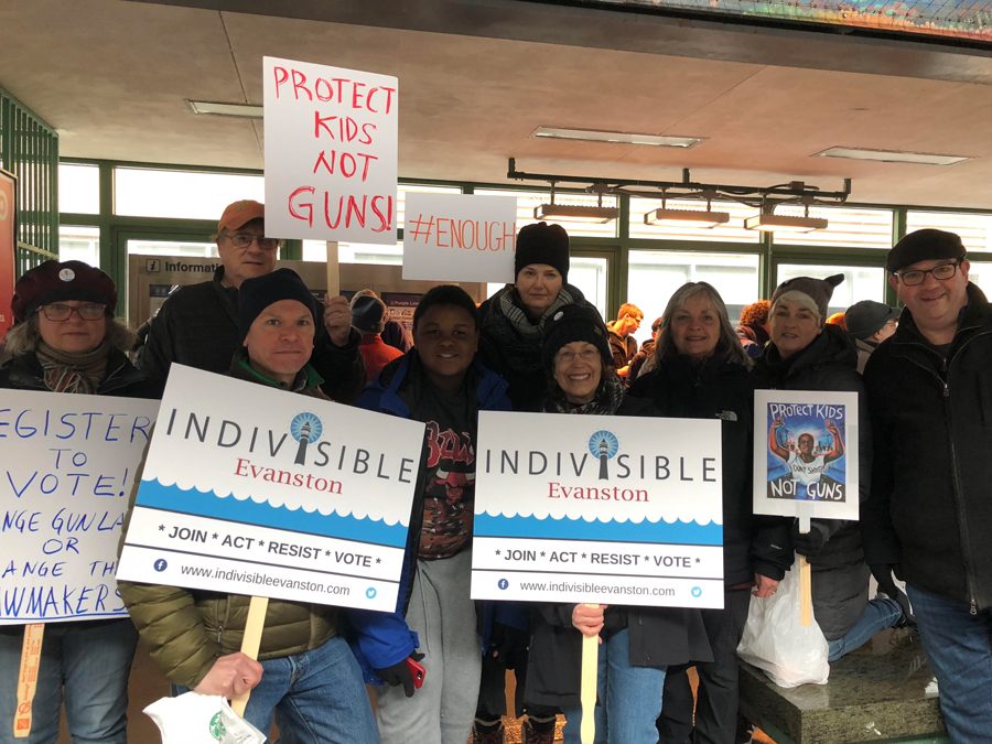 Indivisible Evanston volunteers at the Davis Street CTA station. Volunteers helped with voter registration at the March for Our Lives in downtown Chicago. 

