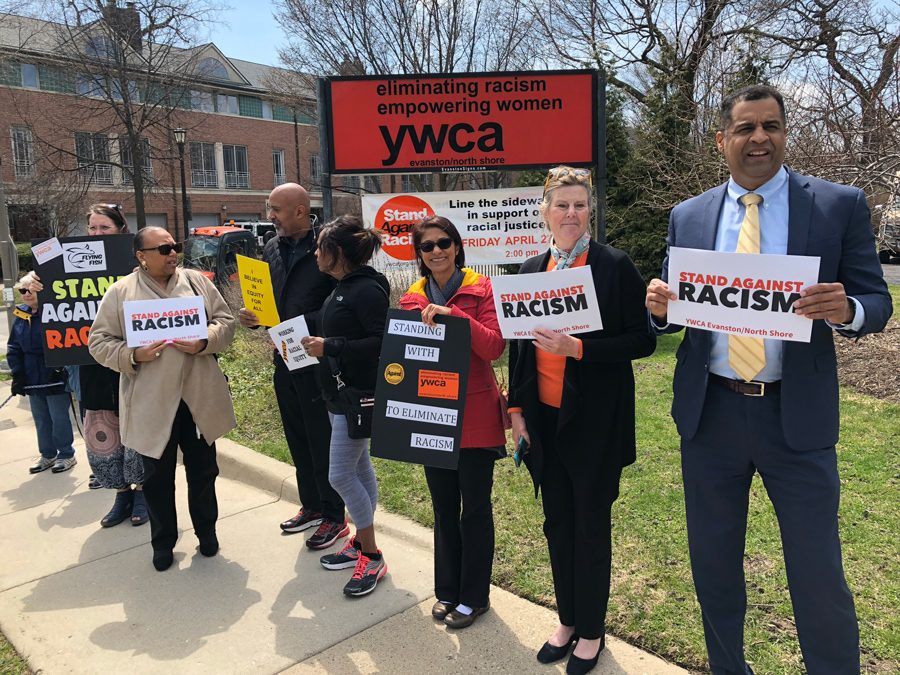 Community members stand on the corner of Ridge Avenue and Church Street at the Evanston/North Shore YWCA. They joined more than 10,000 people on the North Shore to participate in the YWCA’s annual Stand Against Racism event. 