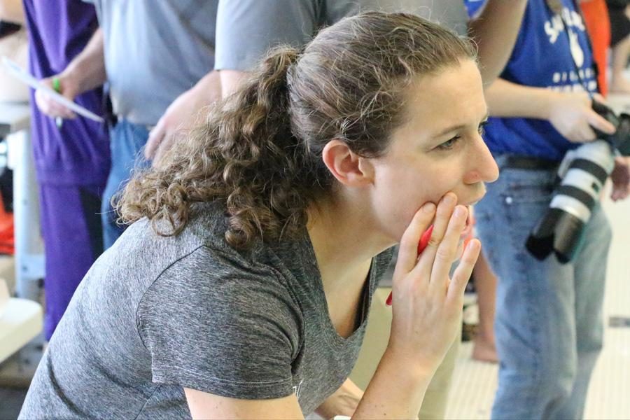 Abby Steketee yells instructions to a swimmer. The Northwestern coach resigned abruptly Wednesday morning.