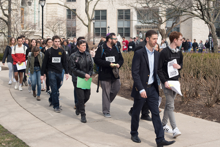 Students+walk+through+campus+for+the+annual+Walk+to+Remember.+The+Thursday+event+was+hosted+by+Alpha+Epsilon+Pi+in+honor+of+Holocaust+Remembrance+Day.+%0A