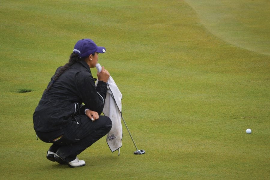 Janet Mao analyzes a putt. Mao led a great Sunday outing for the Cats, salvaging an otherwise lackluster Big Ten Tournament showing.