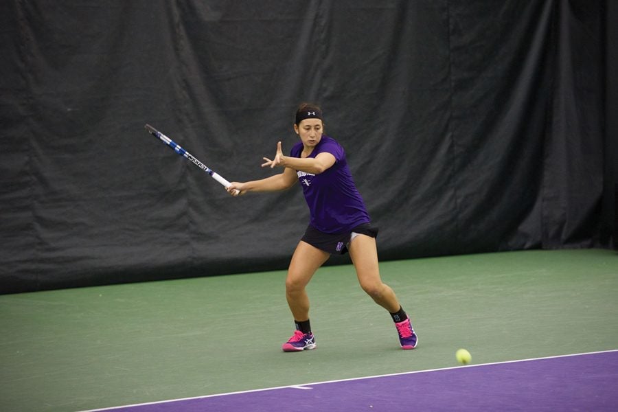 Lee Or readies to hit a forehand shot. The junior clinched the Wildcats’ undefeated Big Ten regular season last weekend, propelling the team into the tournament with momentum.