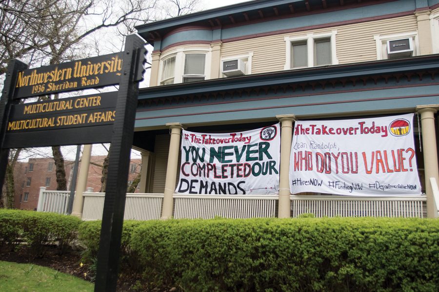 Banners urging University action in commemoration of the Bursar’s Office Takeover hang outside the Multicultural Center. In May, students released a list of 47 demands for improvement in black student experiences, departmentalization efforts and the campus dining transition.