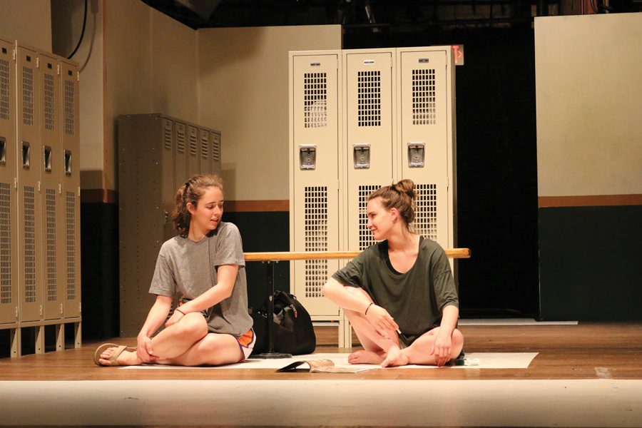 Two actors rehearse onstage for Arts Alliance’s spring show “Dry Land.” The play follows teenagers Amy and Ester who develop a friendship after Amy asks Ester to help her miscarry an unwanted pregnancy. 
