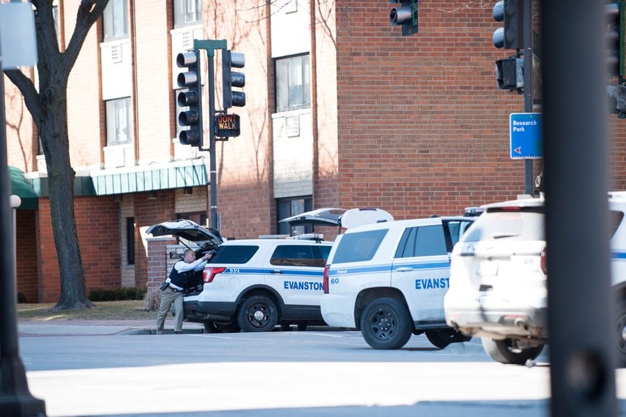 Evanston police respond on March 14 to a gun threat that was later ruled a swatting incident. Northwestern has established a committee to standardize its emergency evacuation plan.