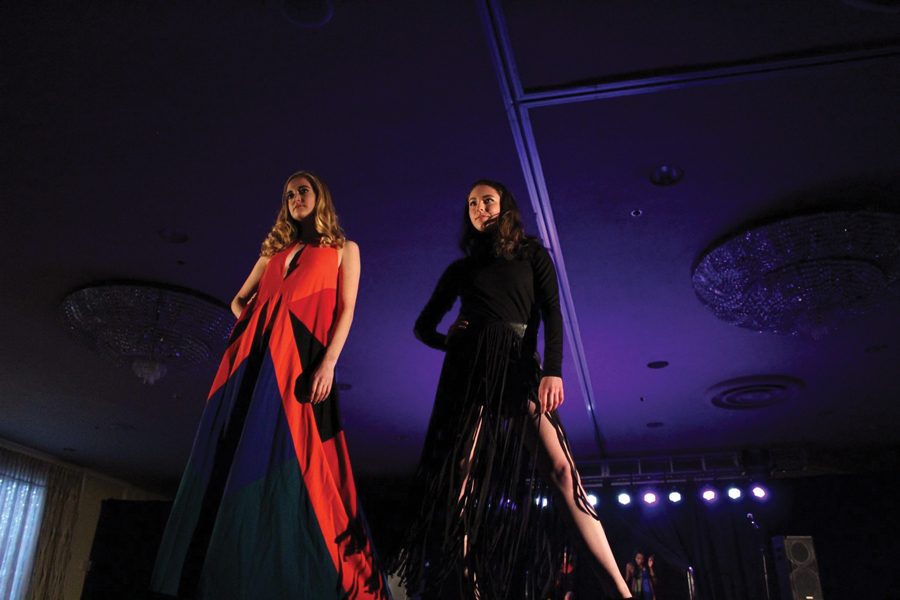 Student models Kelly O’Conor (left) and Gina Johnson pose on the runway at last year’s UNITY fashion show. The two will model at this year’s #SupportCPS show, which features the work of student designers. 