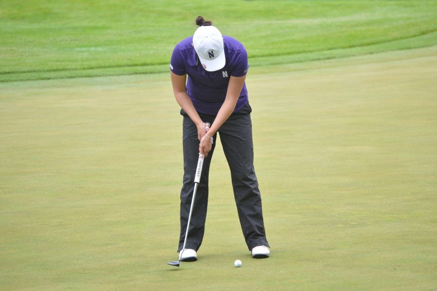 Hannah Kim lines up a put. The senior helped lead Northwestern back to NCAA Tournament Championship match play.